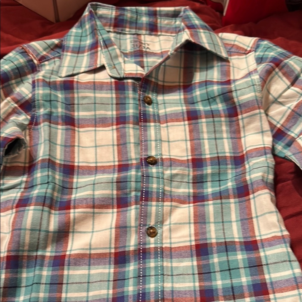 Carter’s flannel teal, blue, and red with khaki pants.